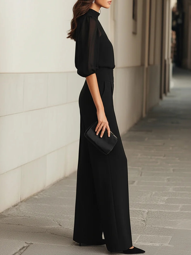 Valentina | Conjunto negro de tres piezas, compuesto por un top camisola transparente y pantalones de pernera ancha.”